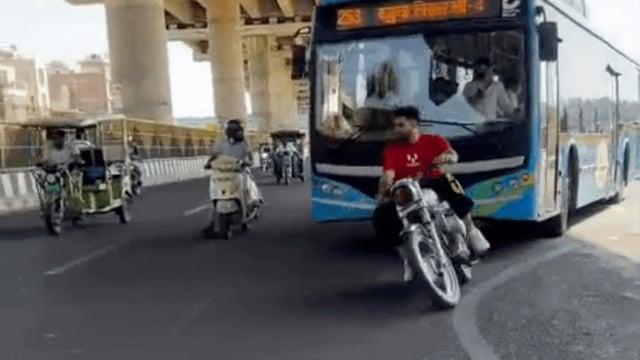 Biker Performs Zig-Zag Stunt in Front of Delhi Bus