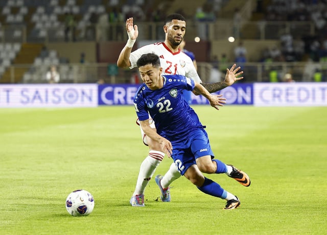 Soccer Football - World Cup - AFC Qualifiers - Group A - United Arab Emirates v Uzbekistan - Al Nahyan Stadium, Abu Dhabi, United Arab Emirates - June 5, 2025 United Arab Emirates' Luan Pereira in action with Uzbekistan's Abbosbek Fayzullaev. REUTERS/Rula Rouhana