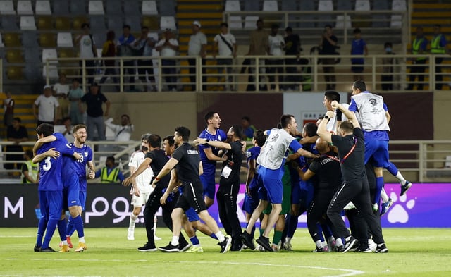 Soccer Football - World Cup - AFC Qualifiers - Group A - United Arab Emirates v Uzbekistan - Al Nahyan Stadium, Abu Dhabi, United Arab Emirates - June 5, 2025 Uzbekistan celebrate after qualifying for the 2026 World Cup. REUTERS/Rula Rouhana