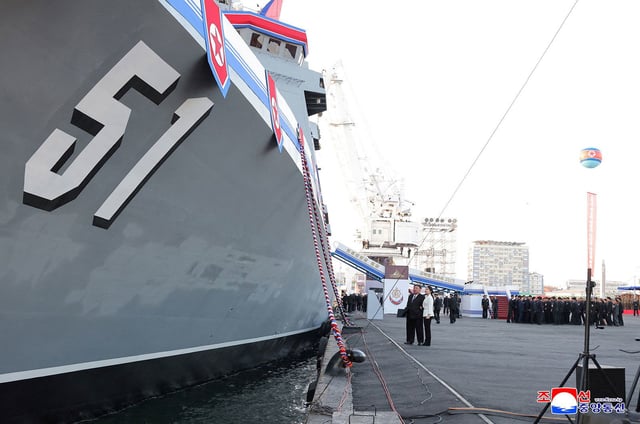 North Korean leader Kim Jong Un, accompanied by his daughter Kim Ju Ae, attends a ceremony for the launch of a "new multipurpose destroyer," in Nampo, North Korea, in this handout picture released on April 26, 2025, by the Korean Central News Agency