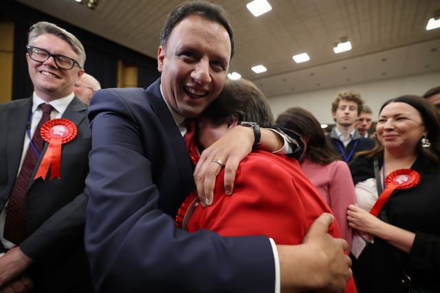 Scottish Labour leader Anas Sarwar hugs Jackie Ballie after Davy Russell, Scottish Labour candidate won the by-election