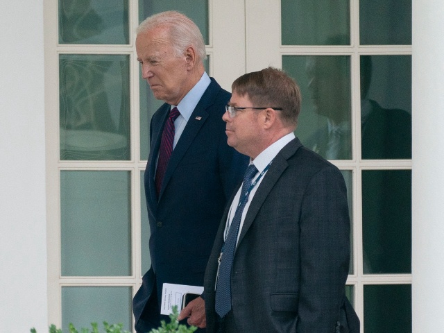 FILE - President Joe Biden walks along the Colonnade at the White House with his physician Kevin O'Connor, Aug. 28, 2023. O'Connor, known to President Joe Biden and others around the White House simply as "doc", has been a part of the president's life for more than a decade and was a central figure to the family when Biden's son Beau was dying of cancer. (AP Photo/Manuel Balce Ceneta, File)