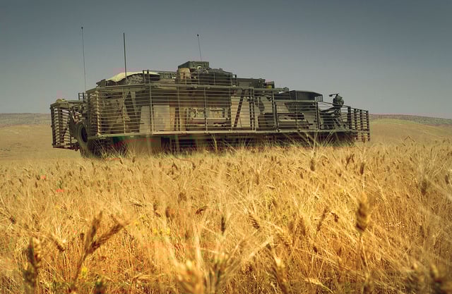 A US Army Stryker Infantry Carrier Vehicle is parked in a field to assist in a joint US and Iraqi Army search operation for hidden weapon caches in Sinjar, Ninawa Province, Iraq, on May 31, 2006.