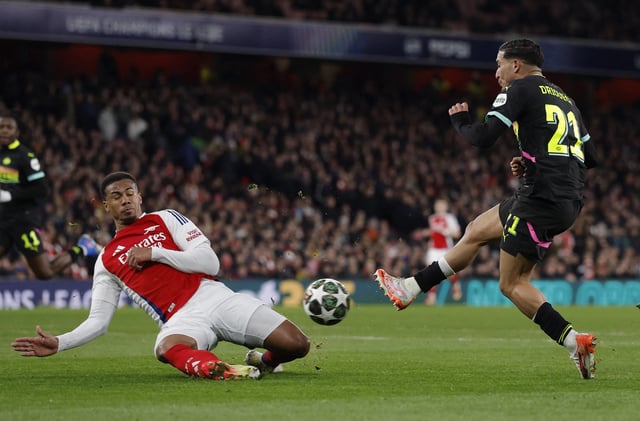 Soccer Football - Champions League - Round of 16 - Second Leg - Arsenal v PSV Eindhoven - Emirates Stadium, London, Britain - March 12, 2025 Arsenal's Gabriel Magalhaes in action with PSV Eindhoven's Couhaib Driouech Action Images via Reuters/Andrew Couldridge/File Photo