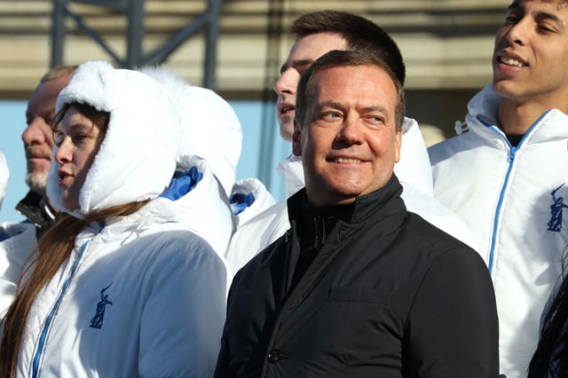 In this pool photograph distributed by Russia&#39;s state agency Sputnik, Dmitry Medvedev, Russia&#39;s former president now serving as deputy chairman of the country&#39;s Security Council, attends a concert and a rally of members and supporters of the United Russia political party in Volgograd on March 12, 2024.