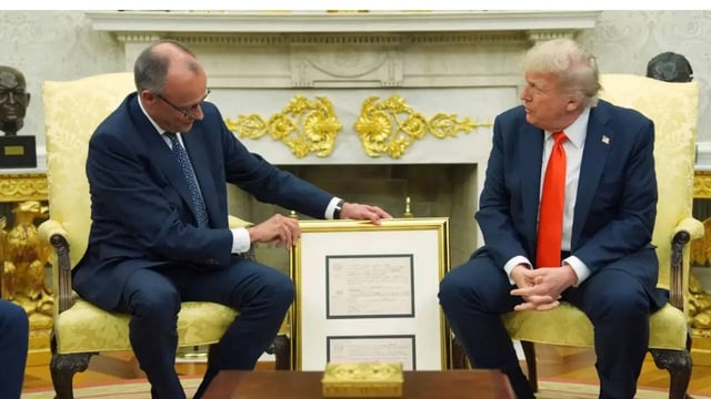 Chancellor Merz’s gold-framed gift sparks viral moment highlighting Trump’s immigrant roots and German heritage.