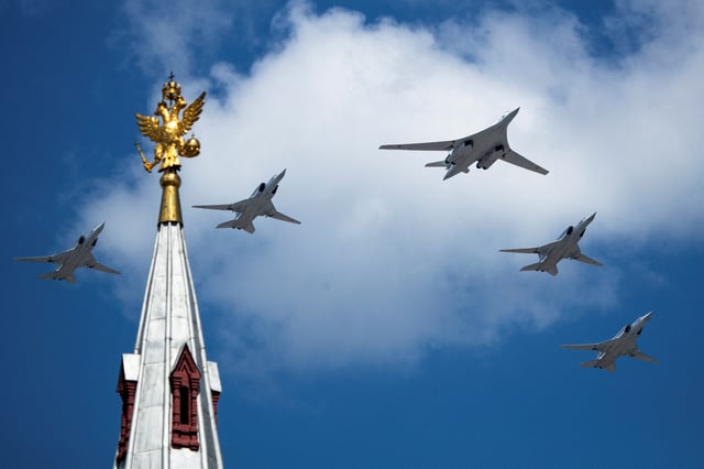 A Russian Tu-160 and Tu-22M3 aircraft fly over Red Square during the Victory Day Parade in Moscow, Russia, June 24, 2020. The military parade, marking the 75th anniversary of the victory over Nazi Germany in World War Two, was scheduled for May 9 but postponed due to the outbreak of the coronavirus disease (COVID-19). Pavel Golovkin/Pool via REUTERS/File Photo