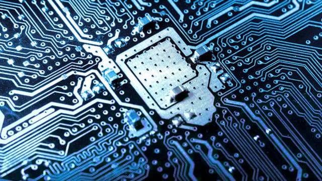 Stock image of a computer circuit board with transistors.