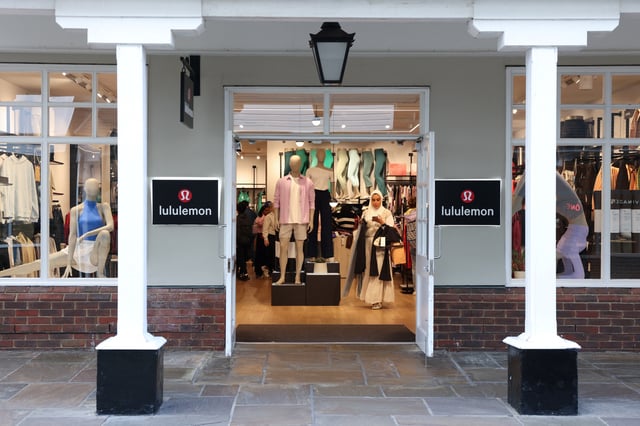 A woman shops inside a Lululemon outlet retail store at Bicester Village in Oxfordshire, Britain, August 21, 2024. REUTERS/Hollie Adams/File Photo