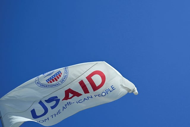 The USAID flag flies outside the USAID building in Washington, D.C., U.S., February 1, 2025. REUTERS/Annabelle Gordon/File Photo
