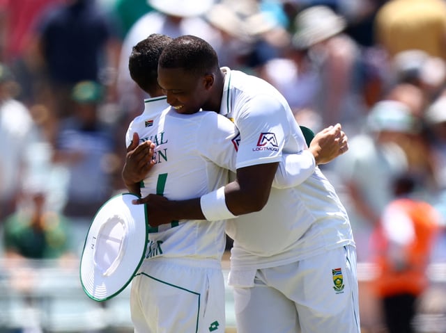 Cricket - Second Test - South Africa v India - Newlands Cricket Ground, Cape Town, South Africa - January 4, 2024 South Africa's Dean Elgar reacts with Lungi Ngidi after the match and retiring from international cricket REUTERS/Esa Alexander/File Photo