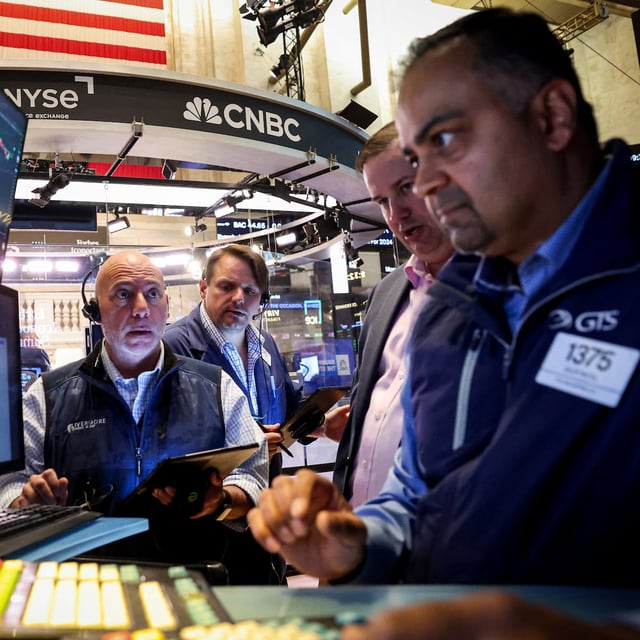 Traders work on the floor at the New York Stock Exchange (NYSE) in New York City, U.S., June 4, 2025.