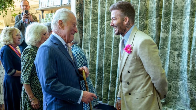 David Beckham laughing with King Charles