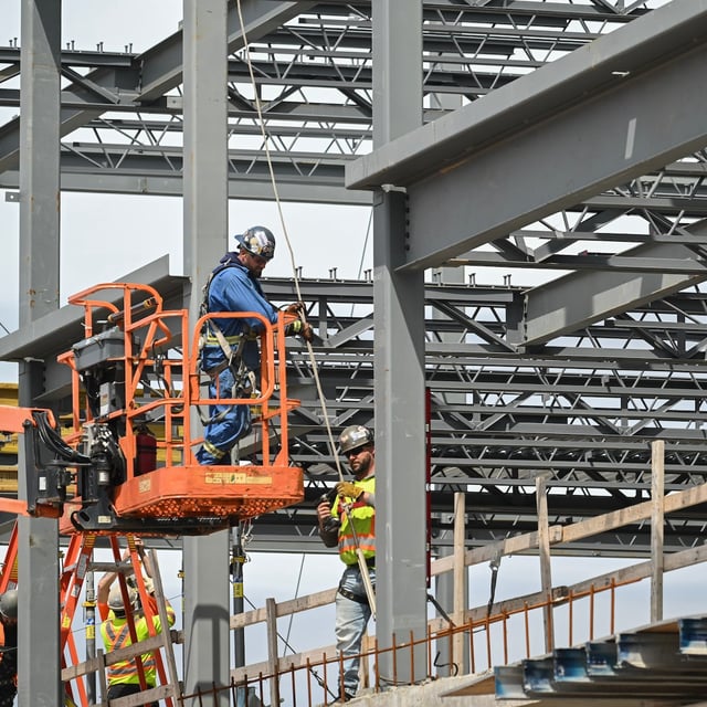 Construction workers on a new condo site in Saint John, New Brunswick on Tuesday, May 6, 2025. THE CANADIAN PRESS/Graham Hughes
