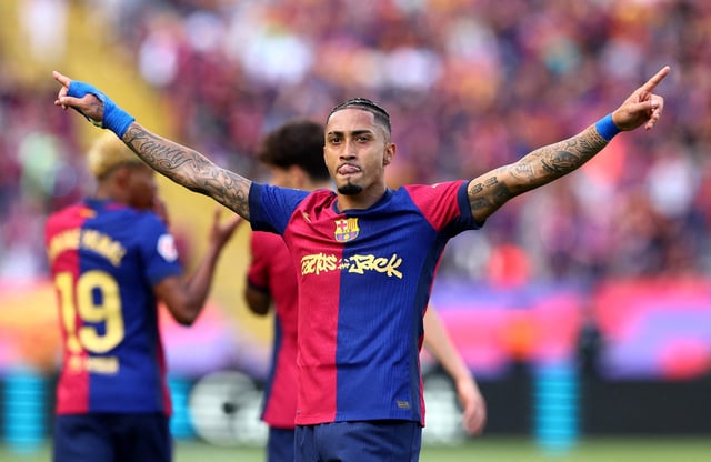 Soccer Football - LaLiga - FC Barcelona v Real Madrid - Estadi Olimpic Lluis Companys, Barcelona, Spain - May 11, 2025 FC Barcelona's Raphinha celebrates scoring their fourth goal REUTERS/Albert Gea/File Photo