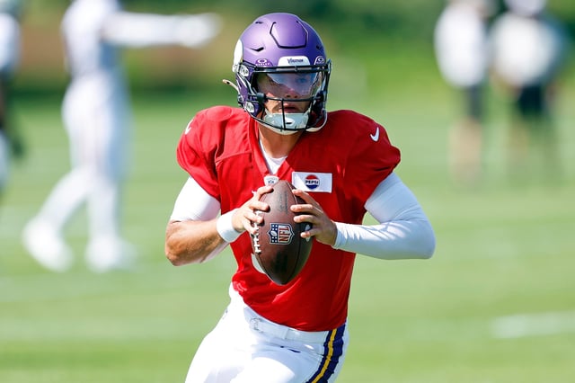 J.J. McCarthy #9 of the Minnesota Vikings participates in a drill during training camp on August 02, 2024 in Eagan, Minnesota.