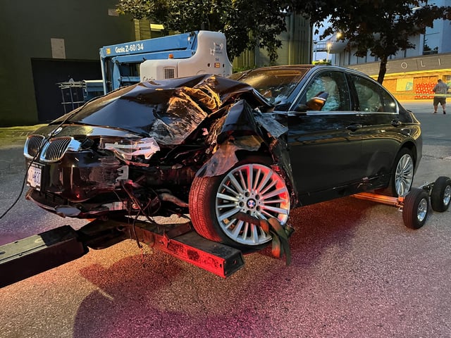 The car being towed away from the Pacific Coliseum on Thursday night.