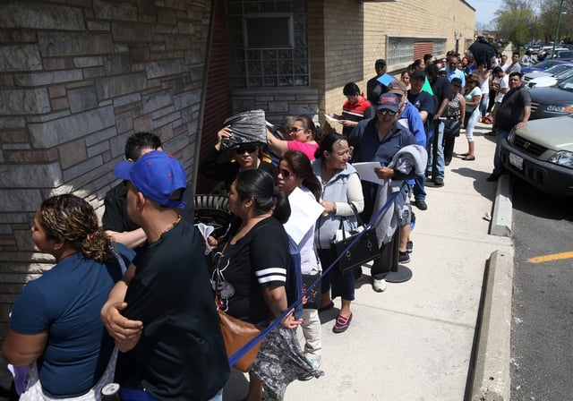 People line up outside the office of Alderman Derrick G. Curtis at 84th Street and Pulaski Road in Chicago on May 2, 2018, in hopes of obtaining a &#34;CityKey&#34; identification card. (Terrence Antonio James/Chicago Tribune)
