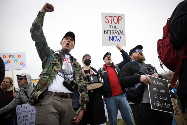 Protesters shout during a "Veterans March" at the National Mall on March 14, 2025.