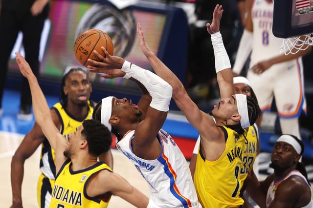 OKLAHOMA CITY, OKLAHOMA - JUNE 05: Shai Gilgeous-Alexander #2 of the Oklahoma City Thunder attempts a shot against Andrew Nembhard #2 of the Indiana Pacers during the fourth quarter in Game One of the 2025 NBA Finals at Paycom Center on June 05, 2025 in Oklahoma City, Oklahoma.