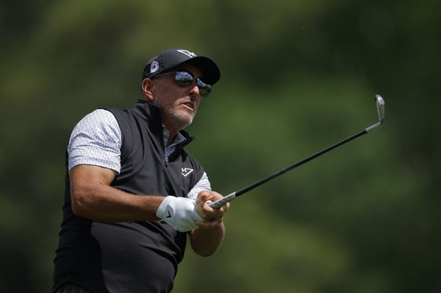 Golf - The Masters - Augusta National Golf Club, Augusta, Georgia, U.S. - April 10, 2025 Phil Mickelson of the U.S. hits his tee shot on the 12th hole during the first round REUTERS/Mike Blake