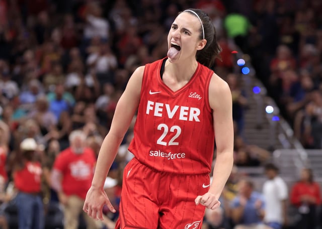 Caitlin Clark #22 of the Indiana Fever reacts after a three pointer during the first half wam at Gainbridge Fieldhouse on August 16, 2024 in Indianapolis, Indiana.