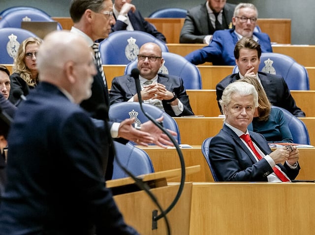Dutch far-right leader Geert Wilders (R) attends a debate at the House of Representatives focused on the fall of the cabinet in The Hague, The Netherlands on June 4, 2025. Geert Wilders brought down the fragile coalition at the head of the Netherlands by withdrawing his PVV party from the government, amid disagreements over immigration, paving the way for early elections. (Photo by Remko de Waal / ANP / AFP) / Netherlands OUT (Photo by REMKO DE WAAL/ANP/AFP via Getty Images)