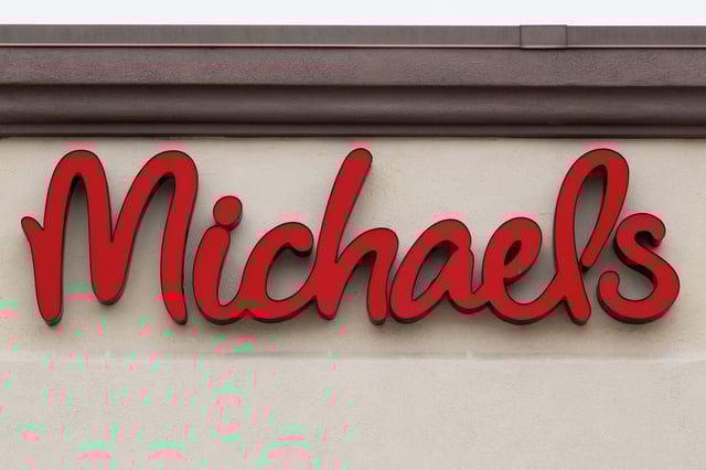 The Michaels corporate logo is displayed on a sign at their store on January 31, 2025 in San Diego, California. The crafts retailer announced it has acquired the intellectual property of Joann, which filed for bankruptcy earlier this year. 
