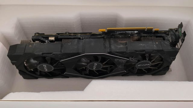 A dusty old KFA2 GeForce card nestled among the rice and pasta