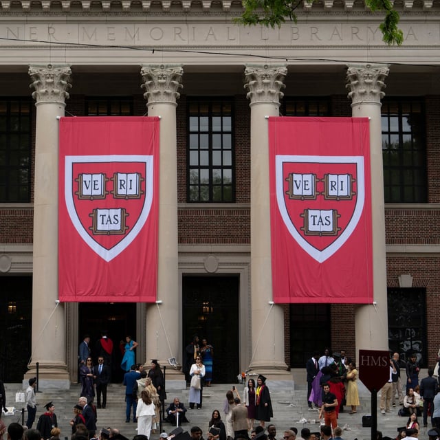 (FILES) Harvard banners in front Widener Library during the 374th Harvard Commencement in Harvard Yard in Cambridge, Massachusetts, on May 29, 2025. A court on June 5 put a temporary stay on Donald Trump's latest effort to stop foreign students from enrolling at Harvard, as the US president's battle with one of the world's most prestigious universities intensified. (Photo by Rick Friedman / AFP) (Photo by RICK FRIEDMAN/AFP via Getty Images)