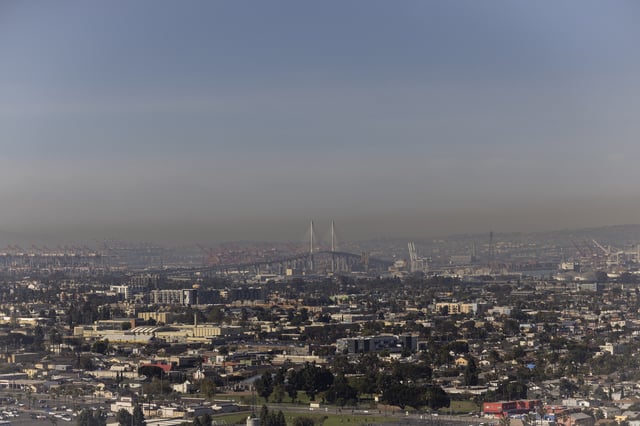 FILE - Smog lingers over the city overlooking the Ports of Long Beach and Los Angeles as seen from Signal Hill, Calif., on Monday, March 10, 2025. (AP Photo/Etienne Laurent, File)