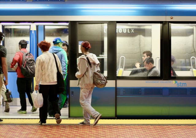 Passengers board a train on the Montreal métro at Lionel-Groulx station in the city's Sud-Ouest borough.