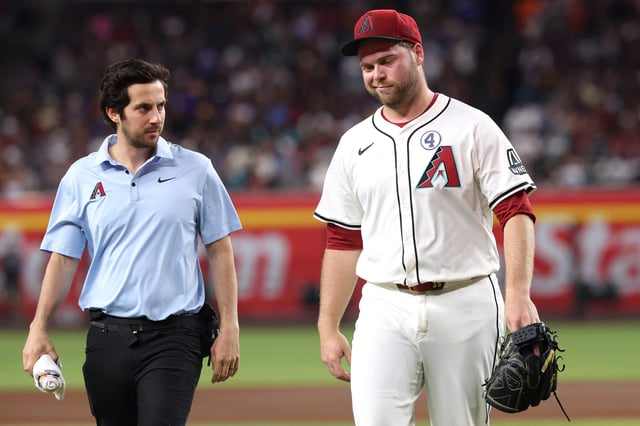 Corbin Burnes walks off the field after feeling discomfort in his right elbow against the Washington Nationals.