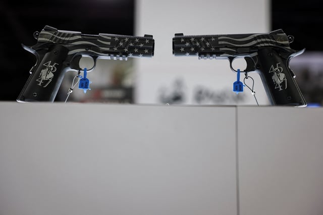 Guns are displayed at a booth during the National Rifle Association (NRA) annual meeting in Atlanta, Georgia, U.S. April 27, 2025. REUTERS/Jeenah Moon/File Photo