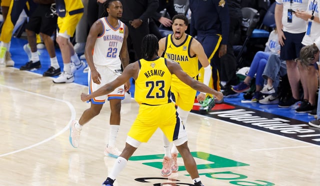 Jun 5, 2025; Oklahoma City, Oklahoma, USA; Indiana Pacers guard Tyrese Haliburton (0) and forward Aaron Nesmith (23) celebrate after Haliburton makes the game winning shot as Oklahoma City Thunder guard Cason Wallace (22) looks on during the fourth quarter during game one of the 2025 NBA Finals at Paycom Center. Mandatory Credit: Alonzo Adams-Imagn Images