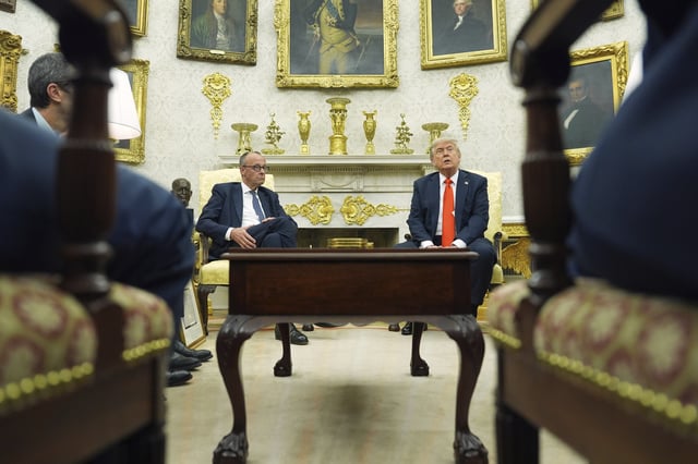 President Donald Trump, right, meets Germany's Chancellor Friedrich Merz in the Oval Office of the White House, Thursday, June 5, 2025, in Washington. (AP Photo/Evan Vucci)
