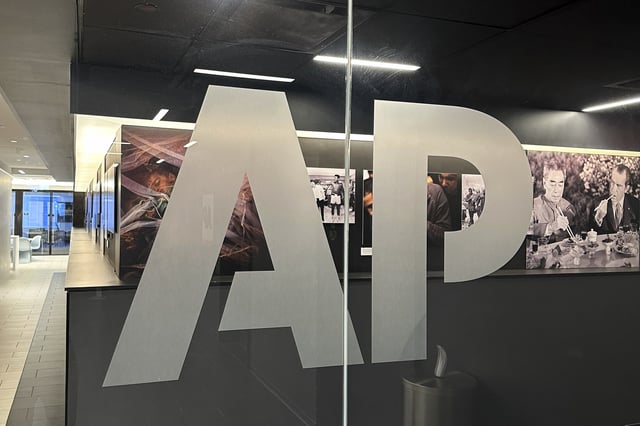 FILE - The Associated Press logo is displayed at the news organization's world headquarters in New York on April 9, 2025. (AP Photo/Aaron Jackson, File)
