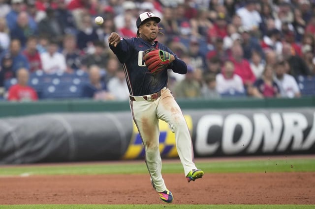 Cleveland Guardians third baseman Jose Ramirez fields a ground ball hit by Houston Astros&#39; Jacob Melton and throws to first base for the out in the third inning of a baseball game in Cleveland, Friday, June 6, 2025. (AP Photo/Sue Ogrocki)