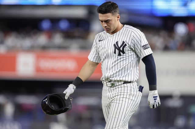 Jun 4, 2025; Bronx, New York, USA;  New York Yankees shortstop Anthony Volpe (11) walks back to the field after hitting into an inning ending double play in the seventh inning against the Cleveland Guardians at Yankee Stadium. Mandatory Credit: Wendell Cruz-Imagn Images