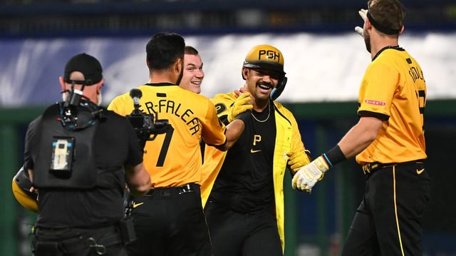 The Pittsburgh Pirates’ Nick Gonzales, middle, celebrates with teammates after hitting a walk-off sacrifice fly for a 5-4 win against the Philadelphia Phillies at PNC Park on Friday, June 6, 2025, in Pittsburgh. (Justin Berl/Getty Images/TNS)