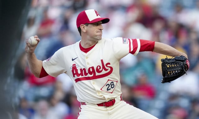 Angels starting pitcher Kyle Hendricks throws to the plate during the first inning of a game against the Seattle Mariners on Friday night at Angel Stadium. Hendricks earned the 100th win of his major-league career in the 5-4 victory. (AP Photo/Eric Thayer)