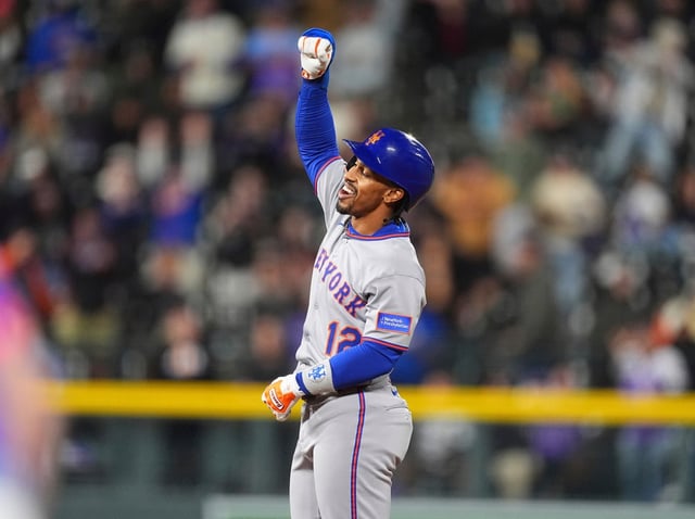 New York Mets pinch-hitter Francisco Lindor gestures to the dugout after reaching second base on a double to drive in two runs off Colorado Rockies relief pitcher Zach Agnos in the ninth inning of a baseball game Friday, June 6, 2025, in Denver. (AP Photo/David Zalubowski)