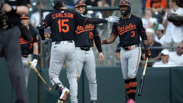 Jun 6, 2025; West Sacramento, California, USA; Baltimore Orioles left fielder Dylan Carlson (15) is greeted by teammates Ramón Urías (29) and Jorge Mateo (3) after hitting a two-run home run against the Athletics during the second inning at Sutter Health Park. Mandatory Credit: D. Ross Cameron-Imagn Images