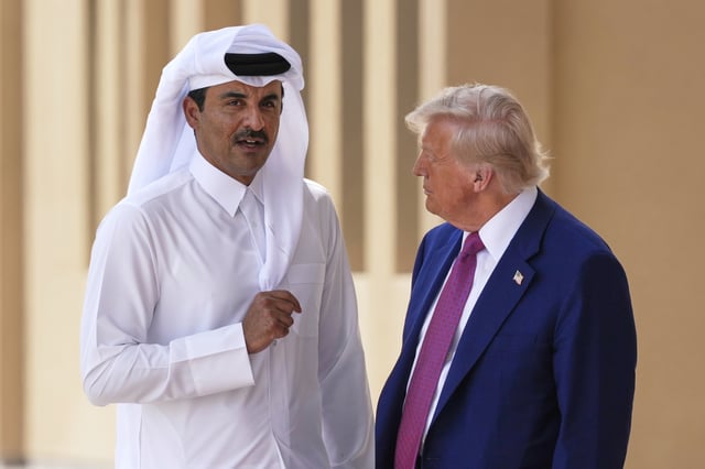 President Donald Trump and Qatar's Emir Sheikh Tamim bin Hamad Al Thani speak at Al Udeid Air Base, Thursday, May 15, 2025, in Doha, Qatar. (AP Photo/Alex Brandon)
