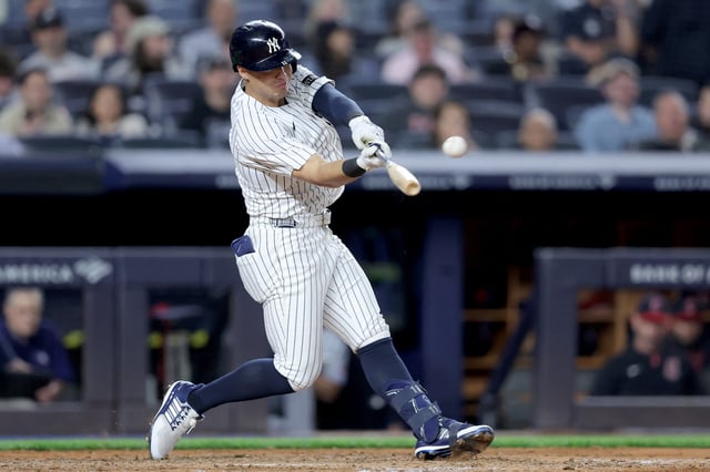 Jun 3, 2025; Bronx, New York, USA; New York Yankees shortstop Anthony Volpe (11) hits a solo home run against the Cleveland Guardians during the seventh inning at Yankee Stadium. Mandatory Credit: Brad Penner-Imagn Images/File Photo