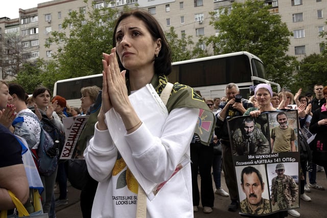 During a prisoner swap in May, Ukrainians in Chernihiv wait to see if their loved ones will be among the arrivals.