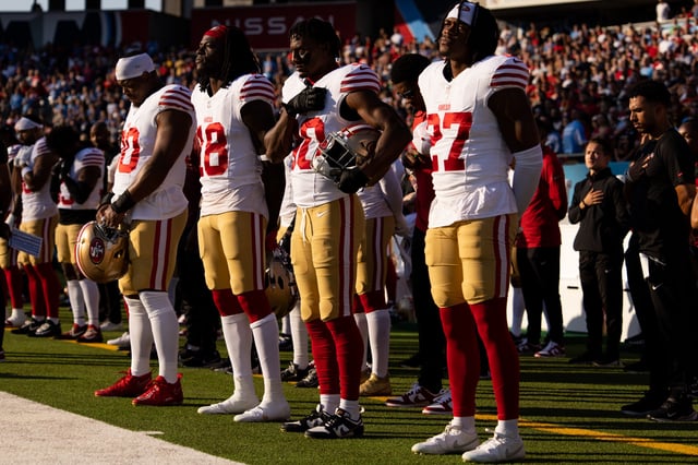 NASHVILLE, TENNESSEE - AUGUST 10: Kevin Givens #90, Chris Conley #18, George Odum #30, and Ji’Ayir Brown #27 of the San Francisco 49ers stand for the National Anthem before the NFL preseason game against the Tennessee Titans at Nissan Stadium on August 10, 2024 in Nashville, Tennessee.