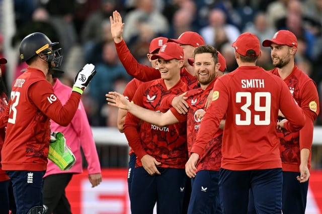 England's Liam Dawson (C) celebrates with team-mates after dismissing West Indies' Johnson Charles during the 1st T20 at Chester-le-Street