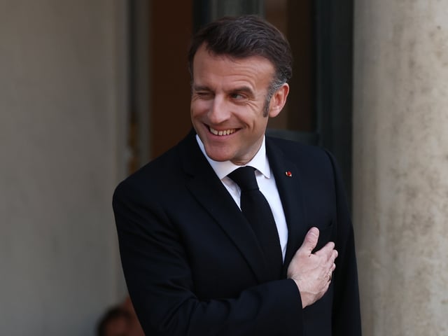 PARIS, FRANCE - MARCH 26: French President Emmanuel Macron waits to greet Ukrainian President Volodymyr Zelensky at Elysee Palace on March 26, 2025 in Paris, France. Ahead of the meeting, the French president's office said the government "will make continuing and strengthening military and financial support to Ukraine its top priority." (Photo by Tom Nicholson/Getty Images)