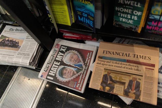 A newspaper front page featuring U.S. President Donald Trump and Elon Musk is displayed at a shop at Ronald Reagan Washington National Airport in Arlington, Virginia, U.S., June 6, 2025. REUTERS/Carlos Barria